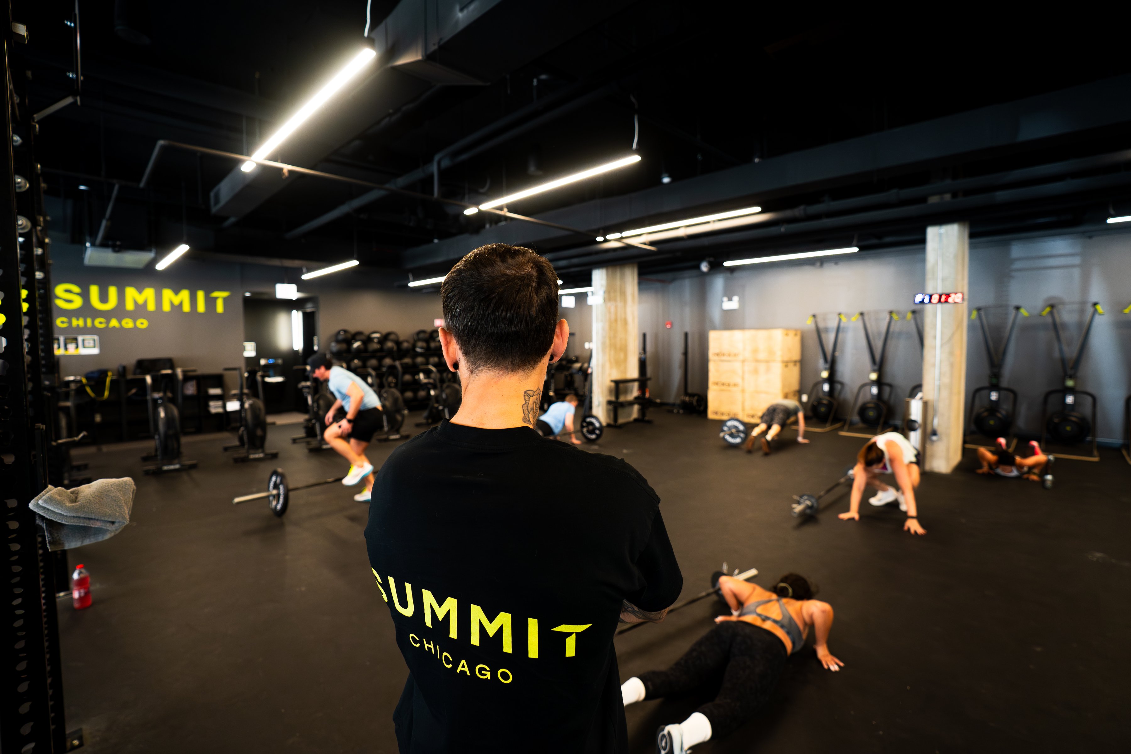 Coach watching a class train on the floor at Summit Fitness Chicago